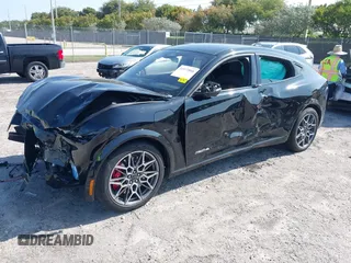 2024 Ford Mustang Mach-E GT z VIN 3FMTK4SX2RMA42734, wystawiony jako IAAI lot #41972888 z przebiegiem 3 378 mil mil oraz . Historia ofert i sprzedaży dostępna na DreamBid. Obrazek 2.