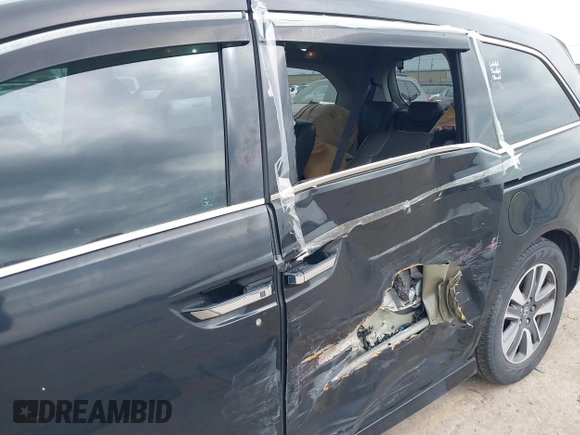 2014 Honda Odyssey Touring with VIN 5FNRL5H9XEB045695, listed as a IAAI auction lot 41545348 with 131,472 mi miles and . Bid and sale history available at carsss.com. Image 6.