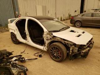 2015 Mitsubishi Lancer Evolution Final Edition with VIN JA32W7FV5FU027374, listed as a Copart auction lot 54689973 with 62,650 mi miles and Salvage Title. Bid and sale history available at carsss.com. Image 4.
