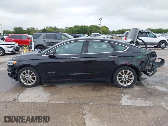 2019 Ford Fusion Hybrid SEL with VIN 3FA6P0MU1KR202860, listed as a IAAI auction lot 41983299 with 133,671 mi miles. Bid and sale history available at carsss.com. Image 15.