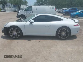 2015 Porsche 911 Carrera z VIN WP0AA2A90FS100123, wystawiony jako IAAI lot #42339229 z przebiegiem 135 198 mil mil oraz . Historia ofert i sprzedaży dostępna na DreamBid. Obrazek 14.