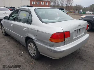 1997 Honda Civic EX with VIN 2HGEJ8643VH561244, listed as a IAAI auction lot 41810988 with 130,000 mi miles. Bid and sale history available at carsss.com. Image 3.