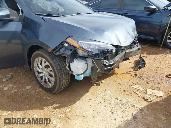 2018 Toyota Corolla L with VIN 5YFBURHE8JP807522, listed as a IAAI auction lot 41609439 with 76,573 mi miles and . Bid and sale history available at DreamBid. Image 6.