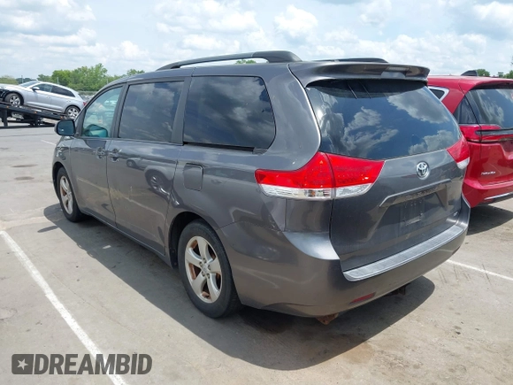 2011 Toyota Sienna LE AAS with VIN 5TDKK3DC1BS164723, listed as a IAAI auction lot 42145480 with 220,349 mi miles. Bid and sale history available at carsss.com. Image 3.
