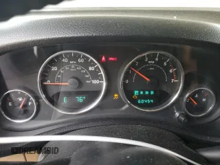 2011 Jeep Wrangler Sahara with VIN 1J4AA5D13BL546742, listed as a Copart auction lot 56415765 with 60,454 mi miles and Salvage title. Bid and sale history available at DreamBid. Image 9.