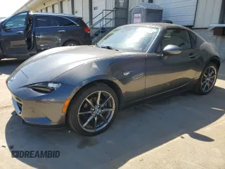 2019 Mazda MX-5 Miata Grand Touring z VIN JM1NDAM76K0302564, wystawiony jako Copart lot #55766575 z przebiegiem 57 858 mil mil oraz Szkoda całkowita • Salvage title. Historia ofert i sprzedaży dostępna na DreamBid. Obrazek 1.
