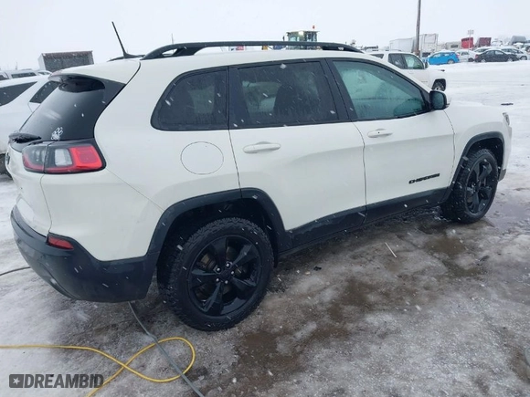 2019 Jeep Cherokee Altitude with VIN 1C4PJMLBXKD320132, listed as a IAAI auction lot 41316702 with 132,056 mi miles. Bid and sale history available at carsss.com. Image 4.