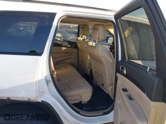 2014 Jeep Grand Cherokee Limited with VIN 1C4RJFBG7EC220677, listed as a IAAI auction lot 41177354 with 148,445 mi miles and . Bid and sale history available at DreamBid. Image 8.