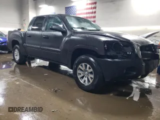 2006 Mitsubishi Raider LS with VIN 1Z7HC28K56S537721, listed as a Copart auction lot 83036764 with 114,576 mi miles and Salvage Title. Bid and sale history available at carsss.com. Image 4.