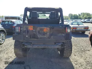 2015 Jeep Wrangler Unlimited Freedom with VIN 1C4BJWDG8FL689194, listed as a Copart auction lot 58016385 with 108,026 mi miles and Salvage title. Bid and sale history available at DreamBid. Image 6.