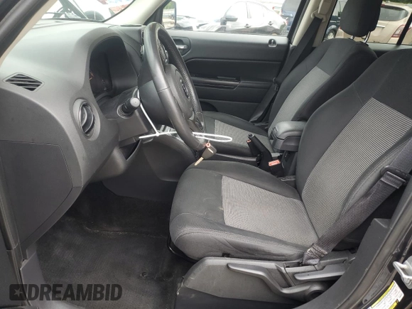 2014 Jeep Patriot Latitude with VIN 1C4NJRFB0ED649779, listed as a Copart auction lot 60444435 with 161,009 mi miles and Salvage title. Bid and sale history available at DreamBid. Image 7.