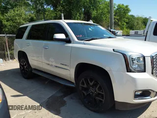 2015 GMC Yukon Denali with VIN 1GKS1CKJ8FR575730, listed as a IAAI auction lot 42048050 with 113,077 mi miles. Bid and sale history available at carsss.com. Image 14.