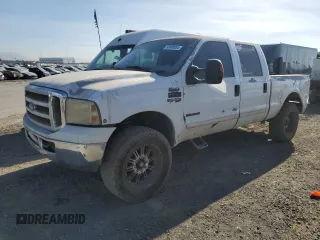 2002 Ford F-250 XL with VIN 1FTNW20F12EA44390, listed as a Copart auction lot 83888084 with 285,250 mi miles and Salvage Title. Bid and sale history available at DreamBid. Image 1.