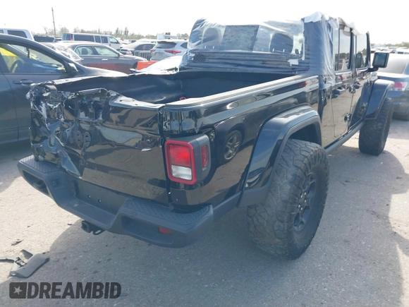 2023 Jeep Gladiator Sport S z VIN 1C6HJTAG4PL577742, wystawiony jako IAAI lot #41793748 z przebiegiem Nie podano mil oraz . Historia ofert i sprzedaży dostępna na DreamBid. Obrazek 4.
