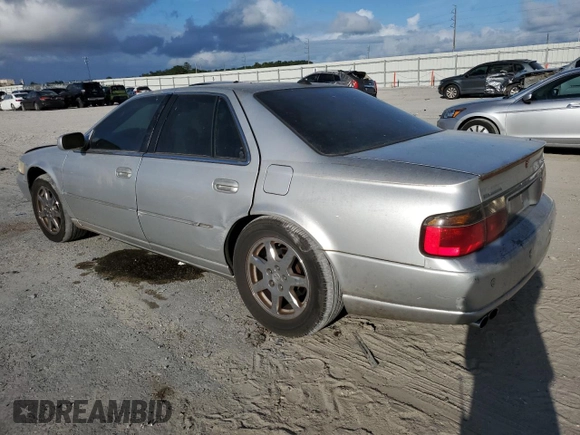 2003 Cadillac Seville Touring STS z VIN 1G6KY54923U101998, wystawiony jako Copart lot #74029304 z przebiegiem 134 157 mil mil oraz Szkoda całkowita • Salvage title. Historia ofert i sprzedaży dostępna na DreamBid. Obrazek 2.
