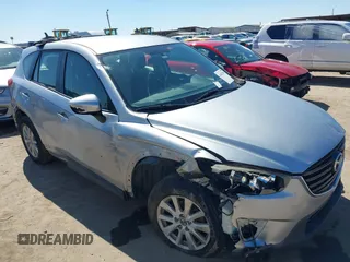 2016 Mazda CX-5 Sport with VIN JM3KE2BY2G0720541, listed as a IAAI auction lot 41652953 with 112,509 mi miles. Bid and sale history available at carsss.com. Image 1.