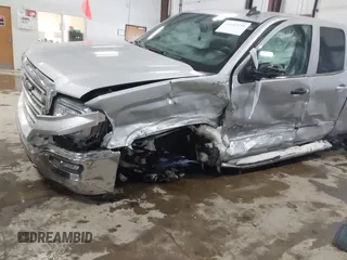2018 GMC Sierra 1500 SLE z VIN 1GTV2MEH8JZ357073, wystawiony jako IAAI lot #41642234 z przebiegiem 105 007 mil mil oraz . Historia ofert i sprzedaży dostępna na DreamBid. Obrazek 6.