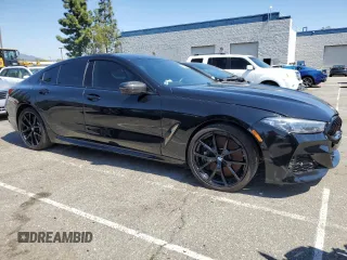 2022 BMW 8 Series M850i with VIN WBAGV8C02NCK08667, listed as a Copart auction lot 50335155 with 22,737 mi miles and Salvage title. Bid and sale history available at DreamBid. Image 4.