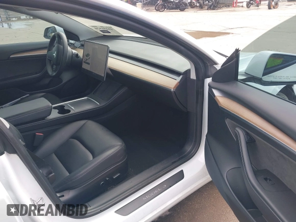 2021 Tesla Model 3 Long Range with VIN 5YJ3E1EB9MF059554, listed as a IAAI auction lot 41231520 with 63,696 mi miles and . Bid and sale history available at DreamBid. Image 5.