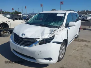 2014 Toyota Sienna LE AAS with VIN 5TDKK3DC4ES515791, listed as a IAAI auction lot 42304201 with 113,139 mi miles and . Bid and sale history available at DreamBid. Image 2.
