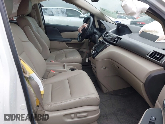2014 Honda Odyssey Touring with VIN 5FNRL5H95EB059729, listed as a IAAI auction lot 42148110 with 135,304 mi miles and . Bid and sale history available at DreamBid. Image 5.
