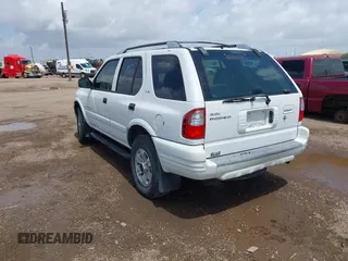 2001 Isuzu Rodeo S z VIN 4S2CK58W414357404, wystawiony jako IAAI lot #42479053 z przebiegiem Nie podano mil oraz . Historia ofert i sprzedaży dostępna na DreamBid. Obrazek 3.