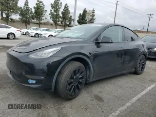 2021 Tesla Model Y Long Range z VIN 5YJYGAEE5MF143672, wystawiony jako Copart lot #55962875 z przebiegiem 74 644 mil mil oraz Szkoda całkowita • Salvage title. Historia ofert i sprzedaży dostępna na DreamBid. Obrazek 1.