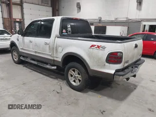 2002 Ford F-150 XLT with VIN 1FTRW08L02KE16948, listed as a IAAI auction lot 41881612 with 168,471 mi miles. Bid and sale history available at carsss.com. Image 3.