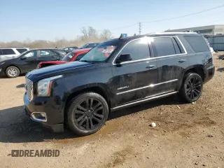 2016 GMC Yukon Denali with VIN 1GKS2CKJ9GR301628, listed as a Copart auction lot 48937035 with 121,863 mi miles and Salvage Title. Bid and sale history available at carsss.com. Image 1.