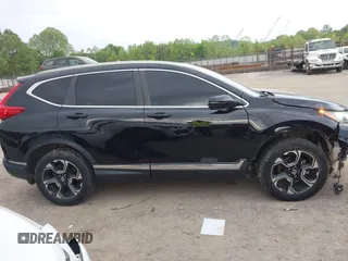 2017 Honda CR-V Touring with VIN 2HKRW2H96HH672017, listed as a IAAI auction lot 42151118 with 144,527 mi miles and . Bid and sale history available at carsss.com. Image 14.