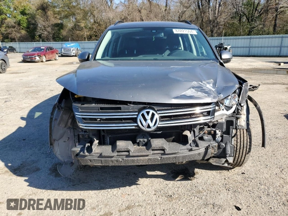 2016 Volkswagen Tiguan S with VIN WVGBV7AX0GW524346, listed as a Copart auction lot 87221564 with 163,609 mi miles and Salvage Title. Bid and sale history available at DreamBid. Image 5.