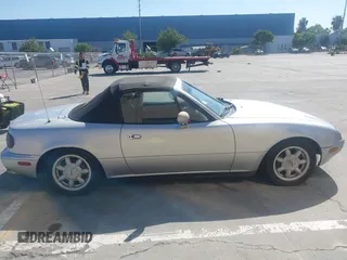 1991 Mazda MX-5 Miata Special Edition z VIN JM1NA3511M1235948, wystawiony jako IAAI lot #42322754 z przebiegiem 151 065 mil mil oraz . Historia ofert i sprzedaży dostępna na DreamBid. Obrazek 13.
