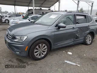 2018 Volkswagen Tiguan SEL z VIN 3VV3B7AX4JM005780, wystawiony jako IAAI lot #41880005 z przebiegiem 149 578 mil mil oraz . Historia ofert i sprzedaży dostępna na DreamBid. Obrazek 2.
