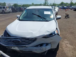 2020 Ford Edge SEL z VIN 2FMPK4J90LBA28960, wystawiony jako IAAI lot #42264189 z przebiegiem 91 312 mil mil oraz . Historia ofert i sprzedaży dostępna na DreamBid. Obrazek 12.
