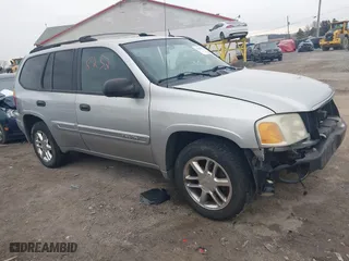 2004 GMC Envoy SLE with VIN 1GKDT13SX42135951, listed as a IAAI auction lot 41668252 with 216,193 mi miles. Bid and sale history available at carsss.com. Image 1.