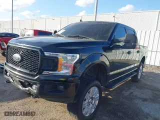 2020 Ford F-150 XL with VIN 1FTEW1E59LKE70874, listed as a IAAI auction lot 41479554 with 104,957 mi miles. Bid and sale history available at carsss.com. Image 2.