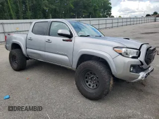 2019 Toyota Tacoma SR with VIN 3TMCZ5AN2KM193701, listed as a Copart auction lot 56776385 with 112,990 mi miles and Salvage title. Bid and sale history available at DreamBid. Image 4.