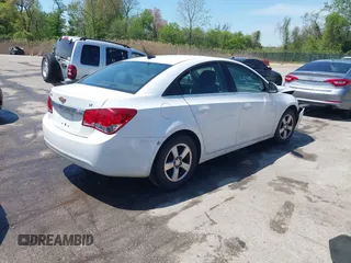 2014 Chevrolet Cruze 1LT with VIN 1G1PC5SB4E7354774, listed as a IAAI auction lot 42104388 with 136,532 mi miles and . Bid and sale history available at DreamBid. Image 4.