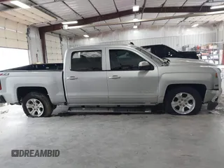 2017 Chevrolet Silverado 1500 LT with VIN 3GCUKREC2HG473554, listed as a IAAI auction lot 42220143 with 80,000 mi miles and . Bid and sale history available at DreamBid. Image 13.