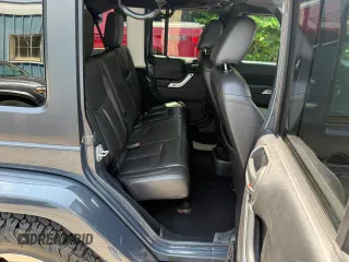 2016 Jeep Wrangler Unlimited Sahara with VIN 1C4BJWEG9GL169490, listed as a Copart auction lot 61507025 with 198,602 mi miles and Clean title. Bid and sale history available at DreamBid. Image 6.