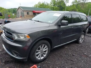 2015 Dodge Durango SXT with VIN 1C4RDJAG6FC177561, listed as a IAAI auction lot 42314437 with 104,898 mi miles and . Bid and sale history available at DreamBid. Image 2.