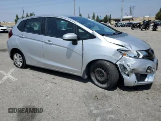 2015 Honda Fit LX with VIN 3HGGK5H55FM748370, listed as a Copart auction lot 61524455 with 87,235 mi miles and Salvage title. Bid and sale history available at DreamBid. Image 4.