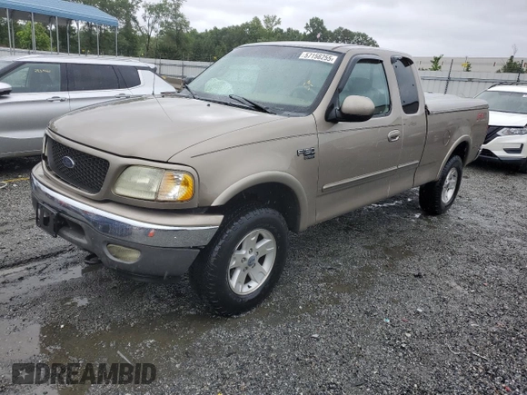 2002 Ford F-150 XL with VIN 1FTRX18L02NA58574, listed as a Copart auction lot 57156255 with 291,950 mi miles and Salvage title. Bid and sale history available at DreamBid. Image 1.