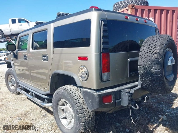 2005 Hummer H2 SUV with VIN 5GRGN23U85H129007, listed as a IAAI auction lot 41625417 with 102389 miles. Bid and sale history available at carsss.com. Image 3.