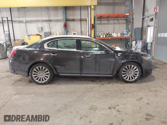 2014 Lincoln MKS with VIN 1LNHL9DK8EG609955, listed as a IAAI auction lot 41580770 with 109,864 mi miles. Bid and sale history available at carsss.com. Image 13.