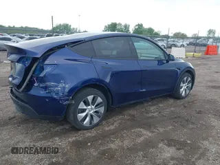 2023 Tesla Model Y Long Range z VIN 7SAYGDEE0PF840787, wystawiony jako IAAI lot #42172489 z przebiegiem 16 314 mil mil oraz . Historia ofert i sprzedaży dostępna na DreamBid. Obrazek 4.