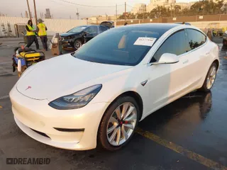 2018 Tesla Model 3 Long Range Battery with VIN 5YJ3E1EA1JF164821, listed as a IAAI auction lot 41277446 with 31,602 mi miles. Bid and sale history available at carsss.com. Image 2.