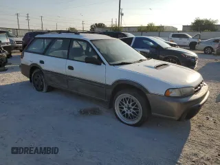 1996 Subaru Legacy Outback with VIN 4S3BG6857T7386841, listed as a Copart auction lot 70968724 with 122,232 mi miles and Salvage title. Bid and sale history available at DreamBid. Image 4.