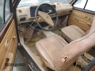 1979 Volkswagen Rabbit z VIN 1793863402, wystawiony jako Copart lot #79580954 z przebiegiem 82 349 mil mil oraz Tytuł czysty. Historia ofert i sprzedaży dostępna na DreamBid. Obrazek 8.