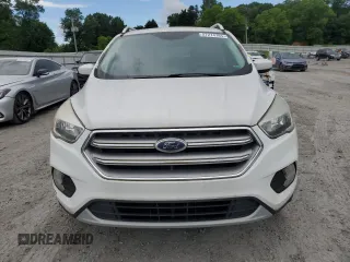 2017 Ford Escape SE z VIN 1FMCU0G99HUA75866, wystawiony jako Copart lot #57274785 z przebiegiem 132 874 mil mil oraz Czysty tytuł • Clean title. Historia ofert i sprzedaży dostępna na DreamBid. Obrazek 5.